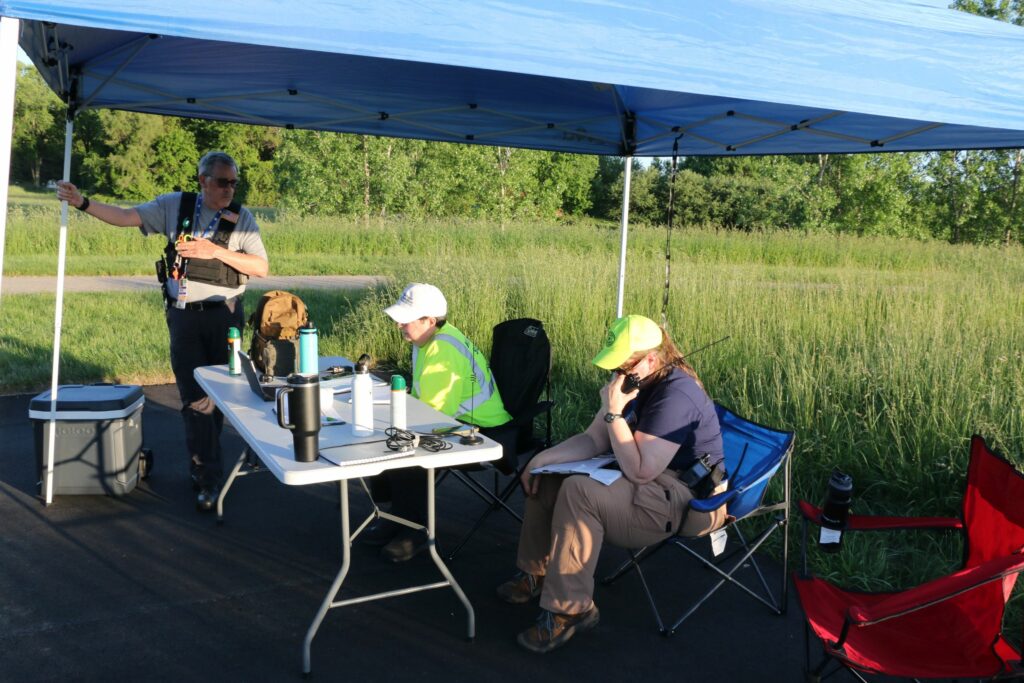 The Comms Team in the staging area, coordinating and keeping track of all the searchers.
