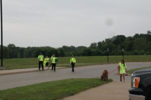 The team returning to staging, in the rain.